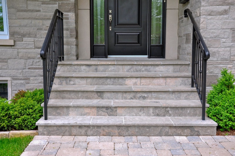 Stonework steps to front door of house