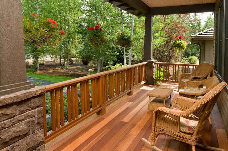 Residential landscaping with green grass and wood fence